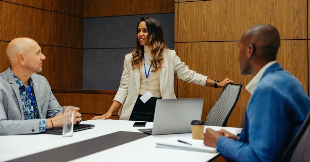 group of people sitting around a conference table